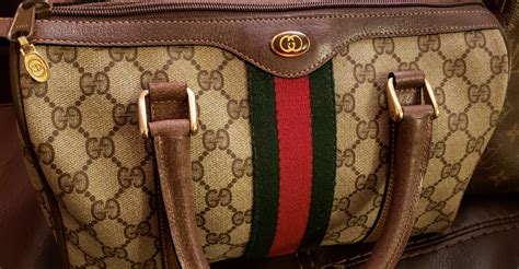 how do you tell if a gucci bag is real|gucci purse real.